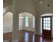 Open-concept foyer leading to the dining room and a wood-framed front door at 30 Scouts Ridge Dr, Covington, GA 30016