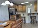 Open kitchen area with stainless steel appliances and a breakfast bar area at 30 Scouts Ridge Dr, Covington, GA 30016