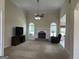 Vaulted living room with a ceiling fan, fireplace and plenty of natural light at 30 Scouts Ridge Dr, Covington, GA 30016