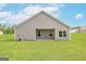 The back of the home has a sliding door and large windows to let in ample light at 251 Oliver Dr, Locust Grove, GA 30248