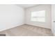 Bedroom with neutral carpet and trim features natural light from the window at 251 Oliver Dr, Locust Grove, GA 30248