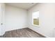 Cozy bedroom with wood floors and a bright window offering natural light at 251 Oliver Dr, Locust Grove, GA 30248