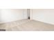 Brightly lit bedroom featuring neutral carpet and white trim at 251 Oliver Dr, Locust Grove, GA 30248
