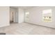 Bright bedroom with neutral carpet and trim, with a view from the windows at 251 Oliver Dr, Locust Grove, GA 30248