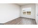 Bright, airy bedroom with wood floors and a view from the window at 251 Oliver Dr, Locust Grove, GA 30248