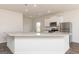 Modern kitchen with a granite island and stainless steel appliances at 251 Oliver Dr, Locust Grove, GA 30248
