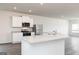 Well-equipped kitchen features stainless steel appliances and ample countertop space at 251 Oliver Dr, Locust Grove, GA 30248