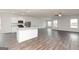 Spacious living room and kitchen with modern flooring and stainless steel appliances at 251 Oliver Dr, Locust Grove, GA 30248