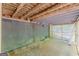 The basement has a concrete floor, wooden beams, and a lattice opening for ample light in this unfinished space at 146 Highland Cir, Mcdonough, GA 30253