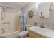 Functional bathroom with a shower-tub combination, vanity, and nautical decor for a refreshing experience at 146 Highland Cir, Mcdonough, GA 30253