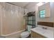 Bathroom includes a shower with curtain and a vanity with decorative bronze back at 146 Highland Cir, Mcdonough, GA 30253