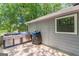 Outdoor grill on a wooden deck with a view of trees at 146 Highland Cir, Mcdonough, GA 30253
