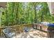 Deck area boasts a large outdoor grill with a wooded view at 146 Highland Cir, Mcdonough, GA 30253