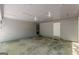 Large empty garage with lighting and door to the outside at 146 Highland Cir, Mcdonough, GA 30253