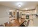 Functional kitchen with stainless steel appliances, a cozy dining area, and easy access to the living room at 146 Highland Cir, Mcdonough, GA 30253
