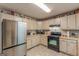Well-equipped kitchen featuring stainless steel appliances, ample cabinetry, and a functional layout for cooking at 146 Highland Cir, Mcdonough, GA 30253