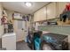 Practical laundry room equipped with modern appliances and shelving for organization and storage at 146 Highland Cir, Mcdonough, GA 30253