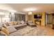 Comfortable living room featuring a large sectional, media setup, and ample space for relaxation and entertainment at 146 Highland Cir, Mcdonough, GA 30253