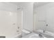 Bathroom with a shower-tub combo, a white toilet, and a sink at 462 Chase Marion Way, Mcdonough, GA 30253