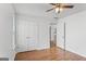 Bedroom featuring hardwood floors and a closet at 462 Chase Marion Way, Mcdonough, GA 30253