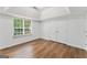 Spacious bedroom with hardwood floors, double closets, and a large window offering natural light at 462 Chase Marion Way, Mcdonough, GA 30253