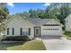 Charming single-Gathering home featuring manicured lawn, attached garage, and a welcoming facade at 462 Chase Marion Way, Mcdonough, GA 30253