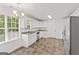 Eat-in kitchen with stainless appliances, tile floors, and bright natural light at 462 Chase Marion Way, Mcdonough, GA 30253