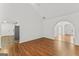 Open-concept living room with archways that lead to other rooms at 462 Chase Marion Way, Mcdonough, GA 30253