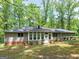 Secluded backyard offering a serene setting with mature trees and ample green space at 50 Ridgeview Dr, Jonesboro, GA 30236