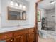 Updated bathroom with a granite countertop, and tiled shower at 50 Ridgeview Dr, Jonesboro, GA 30236