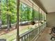 The home features a long covered porch with hanging plants and a serene view at 50 Ridgeview Dr, Jonesboro, GA 30236