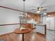 Dining area showcasing wood floors, chandelier, and open kitchen view at 50 Ridgeview Dr, Jonesboro, GA 30236