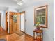 Bright entryway featuring hardwood floors and a charming wooden front door with glass accents at 50 Ridgeview Dr, Jonesboro, GA 30236
