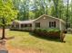 Charming one-story home featuring a covered porch and manicured landscaping at 50 Ridgeview Dr, Jonesboro, GA 30236