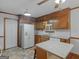 Functional kitchen featuring wood cabinets, white appliances, and an eat-in island at 50 Ridgeview Dr, Jonesboro, GA 30236