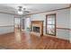 Bright living room featuring hardwood floors and stone fireplace at 50 Ridgeview Dr, Jonesboro, GA 30236