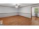Bright living room with warm wood floors and neutral paint at 50 Ridgeview Dr, Jonesboro, GA 30236