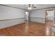 Large living room with warm wood floors and neutral paint at 50 Ridgeview Dr, Jonesboro, GA 30236
