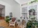 Cozy sunroom showcasing comfortable seating, natural light and peaceful views at 50 Ridgeview Dr, Jonesboro, GA 30236