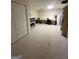 Spacious finished basement featuring an office space, carpet flooring and white walls at 22 Shea Ct, Douglasville, GA 30134
