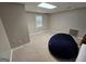 Spacious finished basement with neutral walls, carpet flooring and a window at 22 Shea Ct, Douglasville, GA 30134
