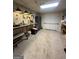 View of basement with workbench, pegboard, storage cabinet, and carpeted floor at 22 Shea Ct, Douglasville, GA 30134