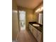 Bathroom featuring a single sink vanity with a dark countertop and toilet room at 22 Shea Ct, Douglasville, GA 30134