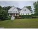 Inviting home featuring a classic design with a well-maintained lawn and mature landscaping at 22 Shea Ct, Douglasville, GA 30134