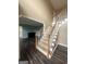 Grand foyer with staircase, hardwood floors, and views of the living room offering an open and inviting entryway at 22 Shea Ct, Douglasville, GA 30134