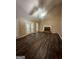 Spacious living room featuring hardwood floors, a fireplace, and access to a patio, perfect for relaxation at 22 Shea Ct, Douglasville, GA 30134