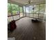 Spacious screened porch with plenty of natural light and room for outdoor seating and entertainment at 22 Shea Ct, Douglasville, GA 30134