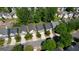 Aerial view of neighborhood homes, tree-lined street, and driveway parking at 11224 Aliyah Dr, Hampton, GA 30228