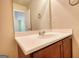 Bathroom vanity featuring a white countertop and ample mirror, with modern faucet fixtures at 11224 Aliyah Dr, Hampton, GA 30228