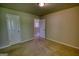 Bedroom featuring 2 large doors, neutral colored walls, and carpeted floor at 11224 Aliyah Dr, Hampton, GA 30228